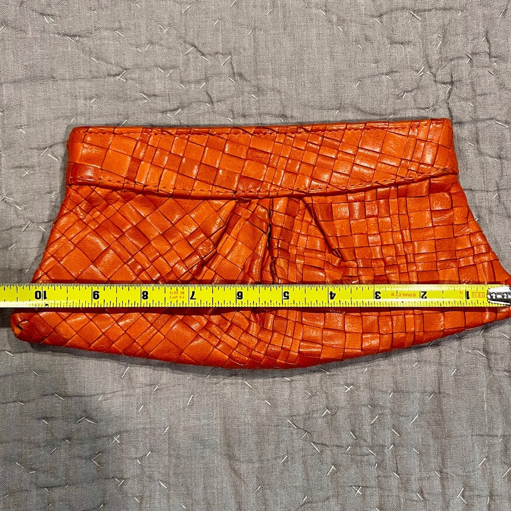 Lauren Merkin clutch, woven orange leather, pink striped lining, made in NYC